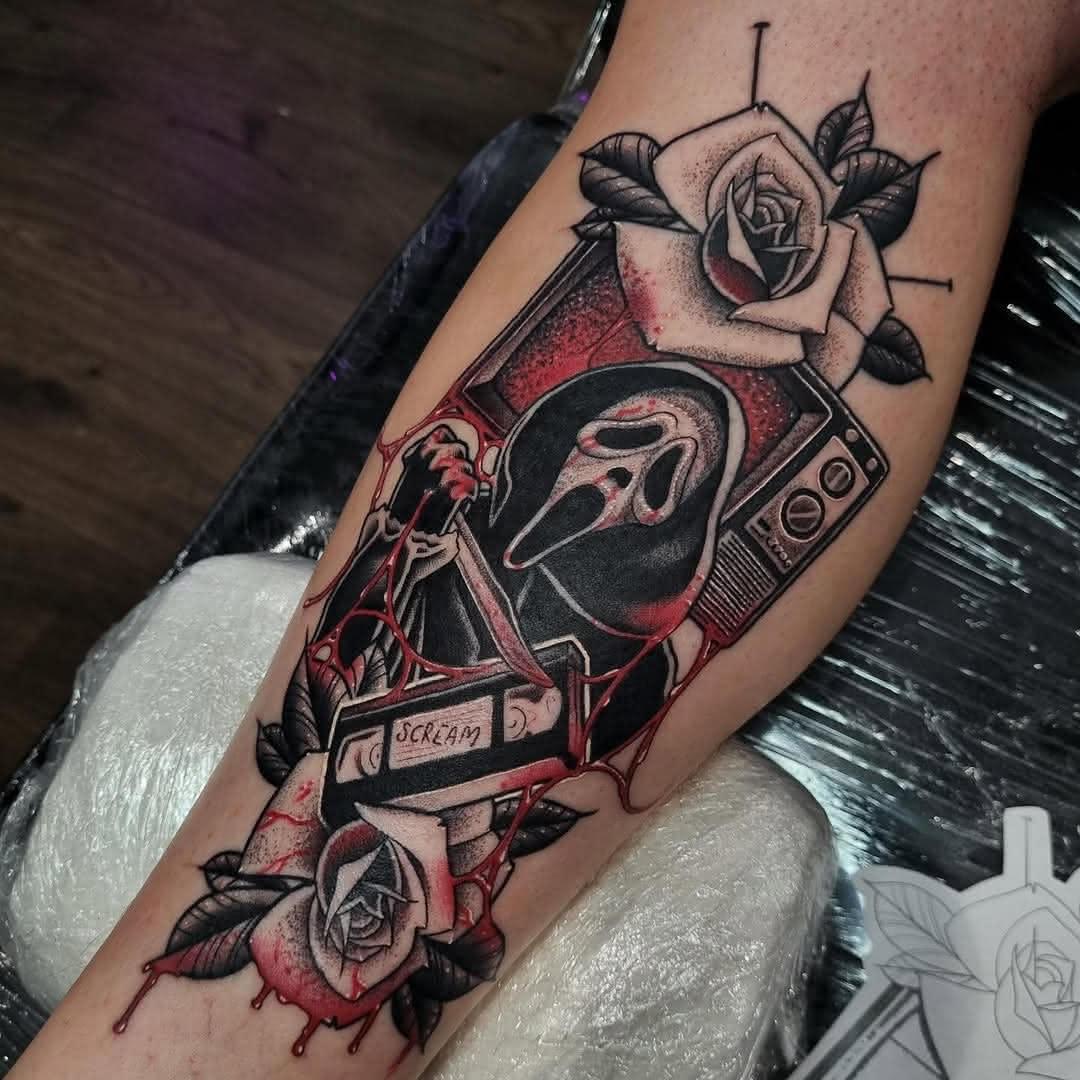 Neo-traditional Scream tattoo with Ghostface inside a television and roses by Nicholas.