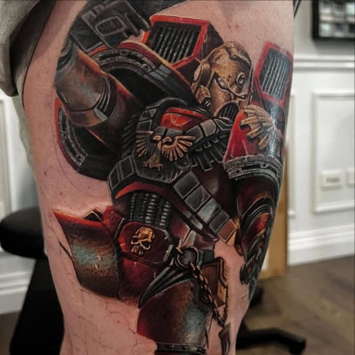 Colour Warhammer 40,000 Space Marine tattoo in red armour by Independence Ink.